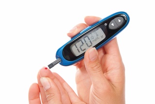 Blood sugar meter being used