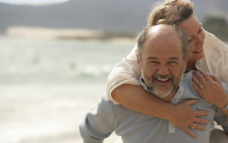 Couple laughing on beach