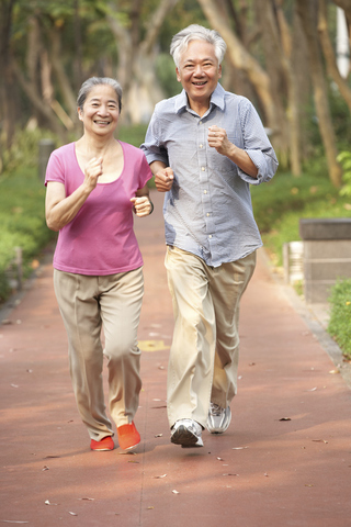 Elderly couple jogging