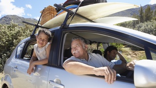 Family going on vacation in a car